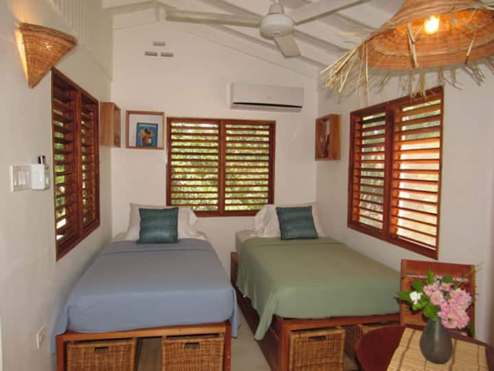 Two single or one king bed in first bedroom.  Walk through the first bedroom to access the second bedroom