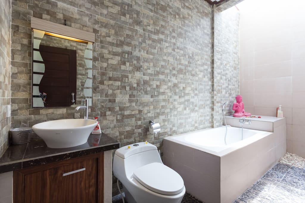 spacious bathroom with hot shower.