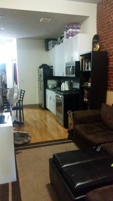 Kitchen and living room right outside of door
