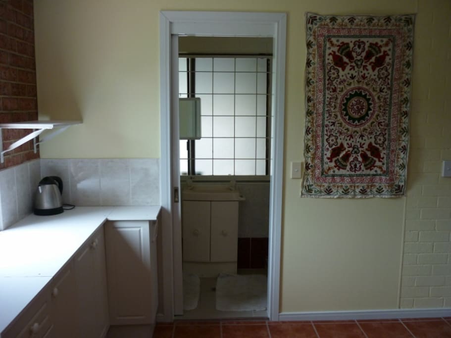 en suite with a shower and toilette.