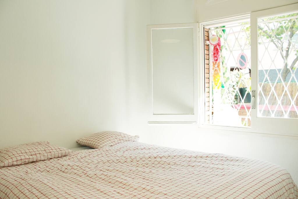 Very bright and large bedroom with outside window