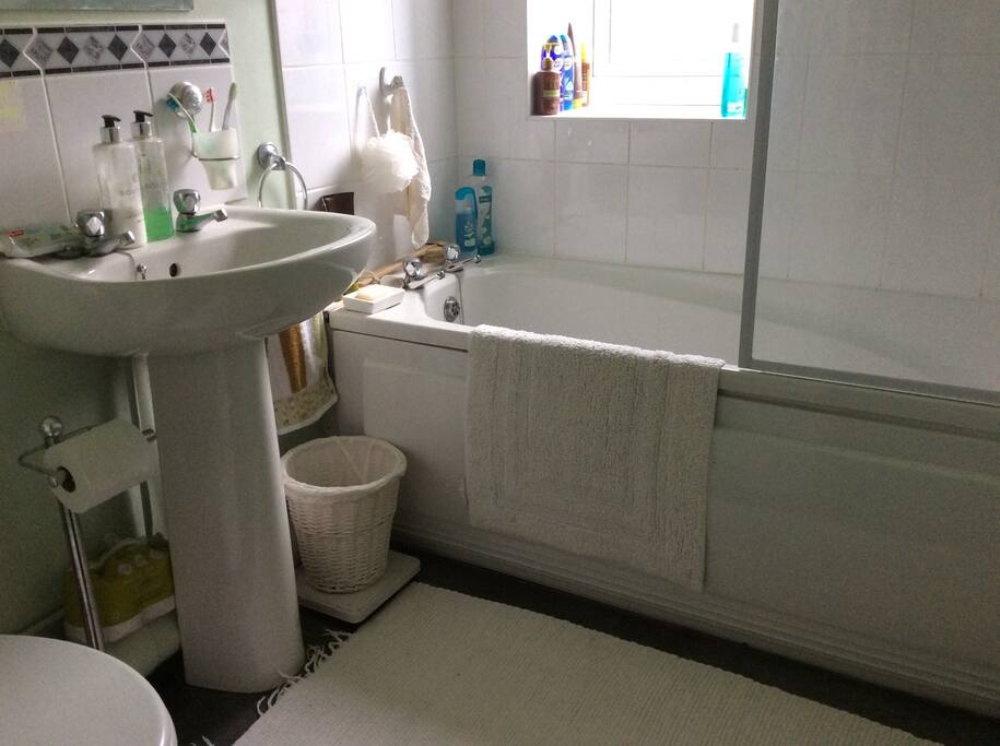 Bathroom with shower over bath, towels available for your convenience