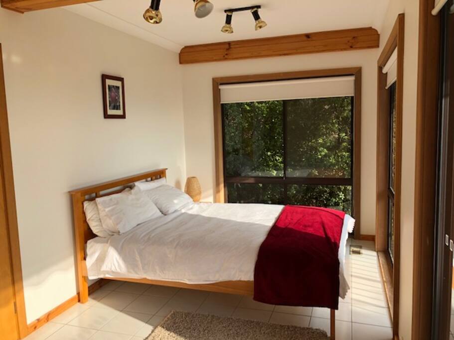 Queen size bedroom & sofa bed facing balcony with stunning views