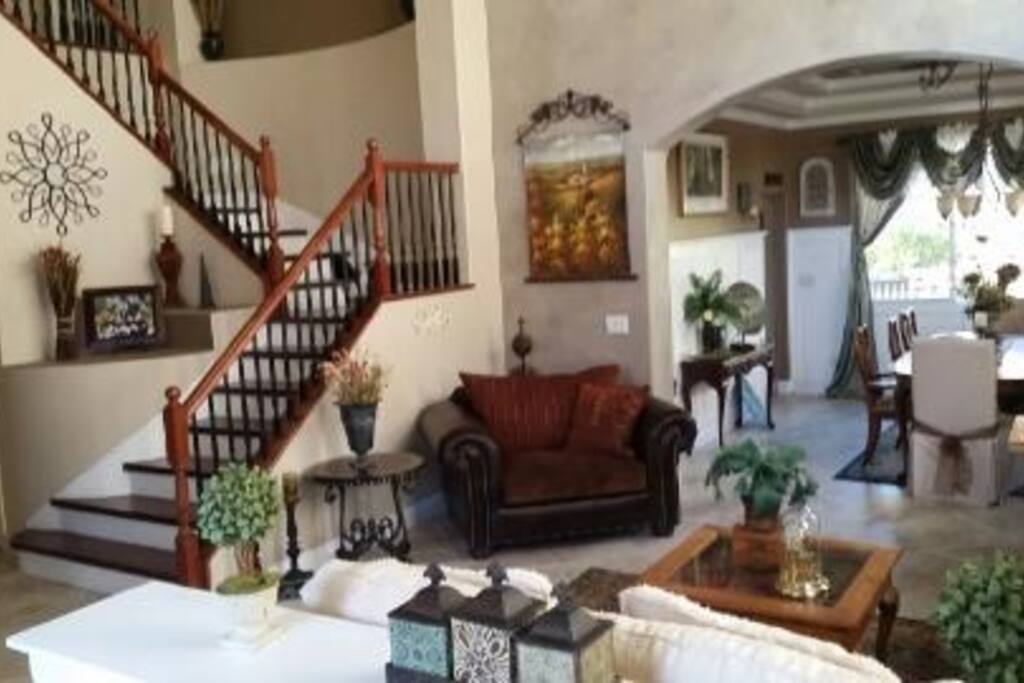 Living room with 2 story coffered ceiling