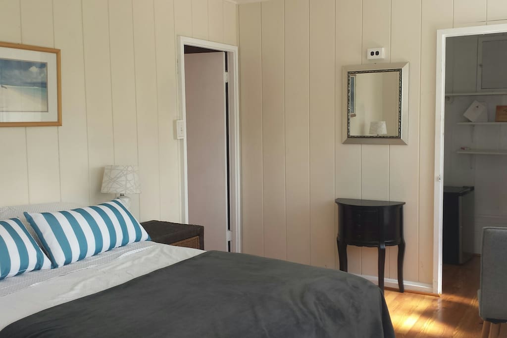 Guest room, closet on right has refrigerator, coffee maker, table chairs