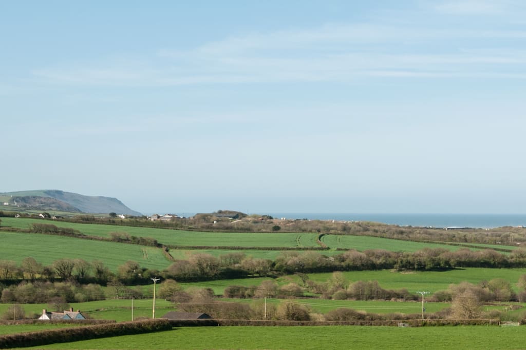 View from bedroom window over the fields to Widemouth Bay