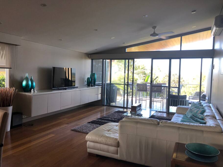 Spacious living area with smart TV.