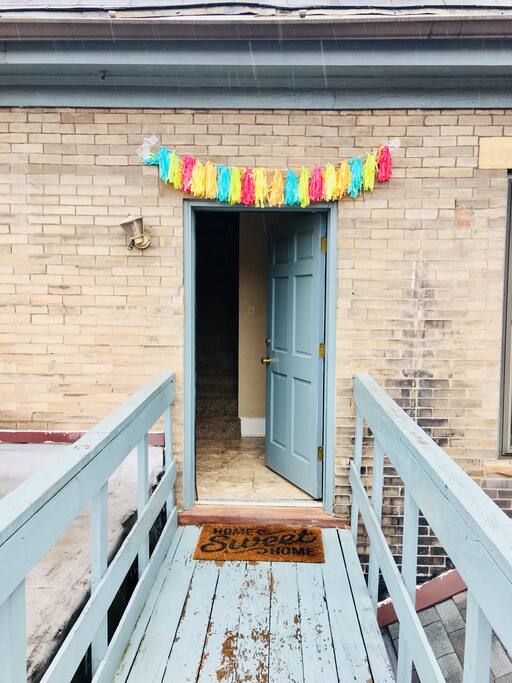 Main entrance up the stairs in the back of the house.