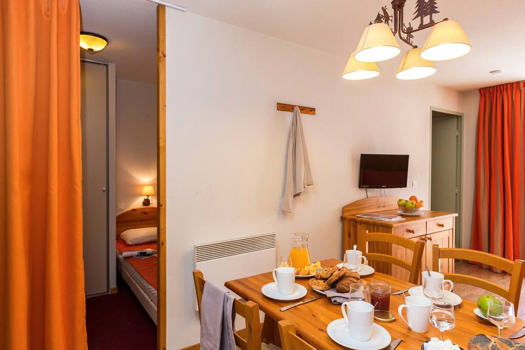 Enjoy your meal at the dining table with seating for six.