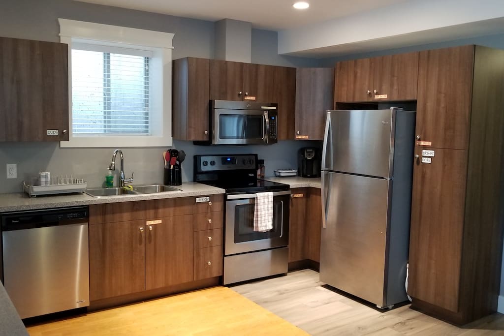 Fully stocked kitchen with stainless steel appliances