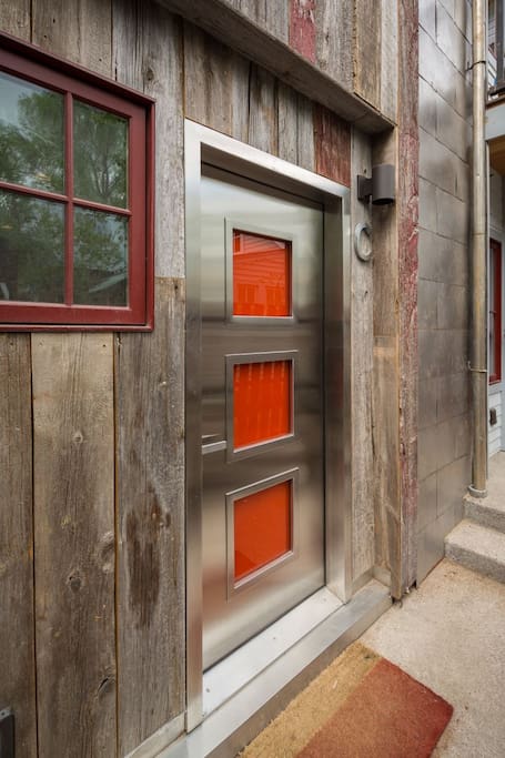 Contemporary orange, custom front door.