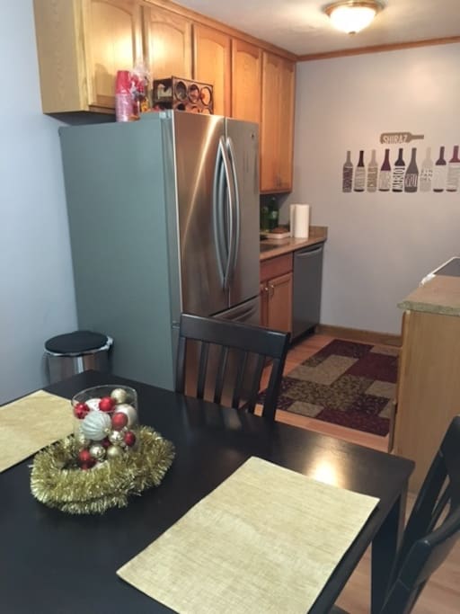 Kitchen includes new fridge, dishwaser and microwave with table for four