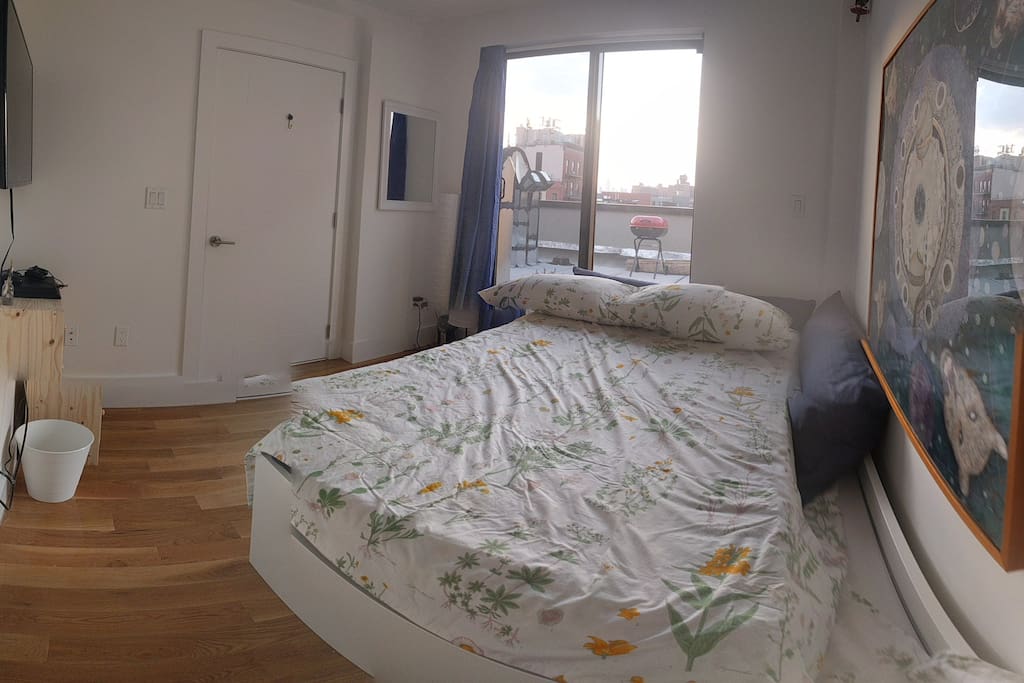 Guest room has body pillows to snug after a busy day in the city.