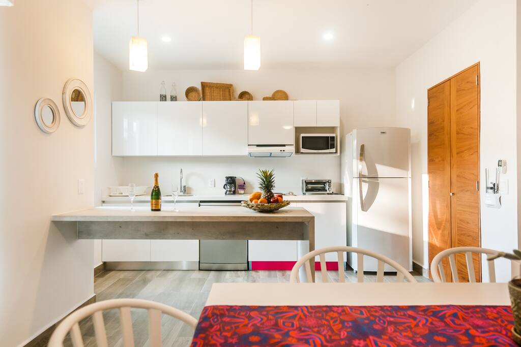 Dining area with a fully equipped kitchen