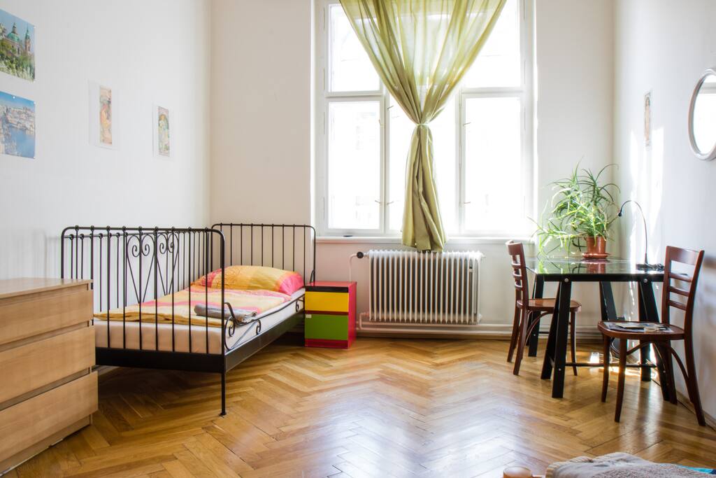 There are three beds in the room with the view to the main street. We provide flip-flops, towels and fresh water :)