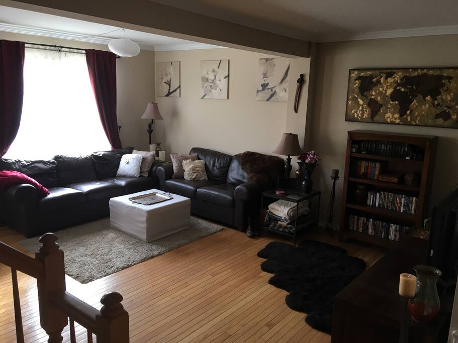 The open living room with plenty of natural light allows guests to relax. It also has some unique pieces from our world travels.