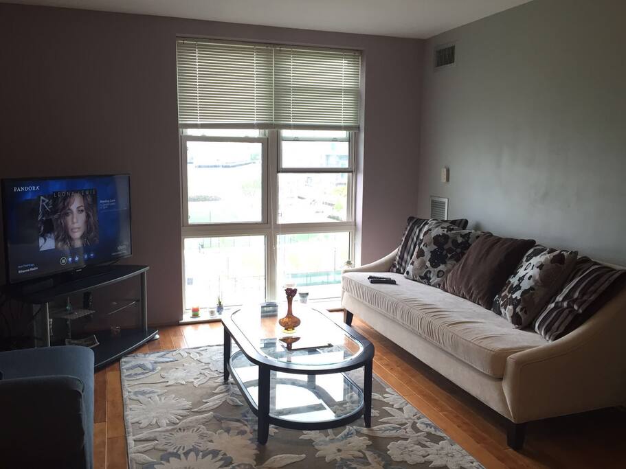 Couch turns into a super comfortable twin bed. High ceiling to floor windows provide amazing views.