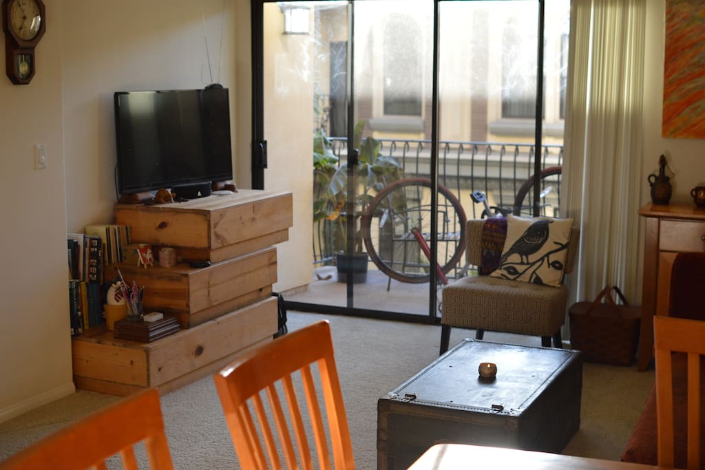 Other side of living room, showing the TV and patio.