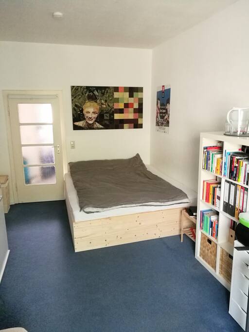 Your room including desk, pull-out couch and double bed