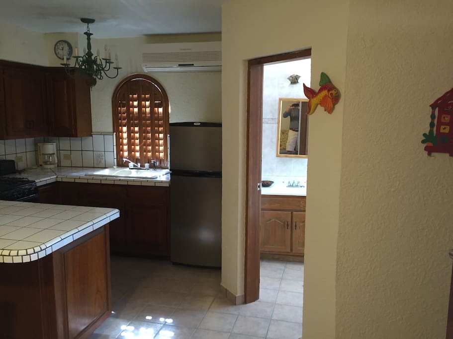 Looking at the right side of the kitchen and entrance to the bathroom