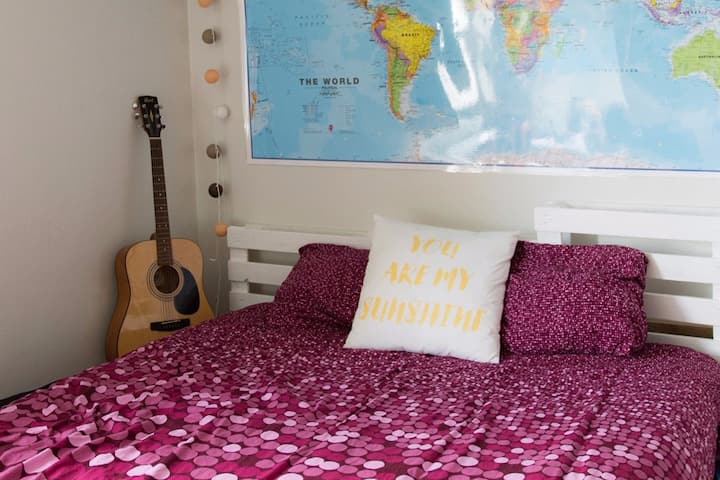 Cosy bedroom with a handmade euro-pallets bed.