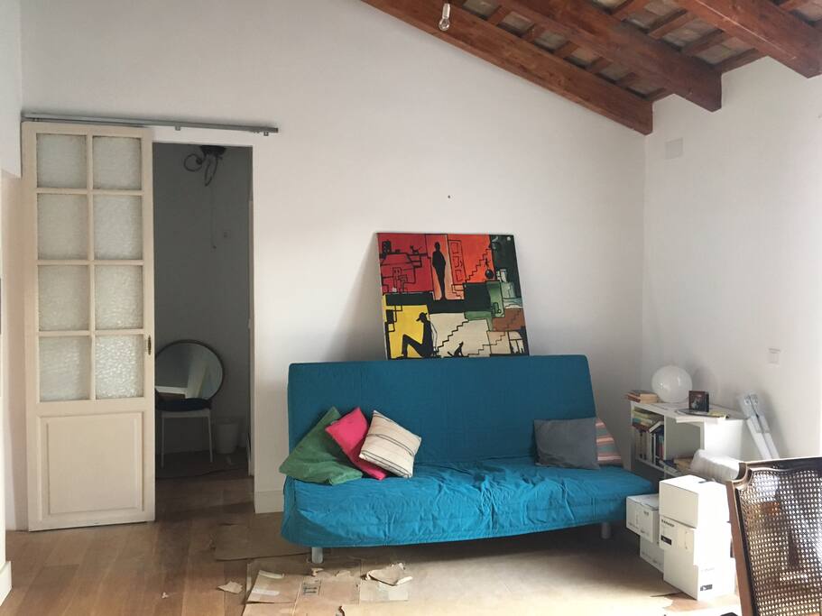 The sitting room on moving in day, and the door to the dressing room and bathroom
