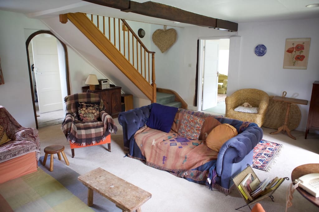 Main sitting room looking towards the staircase