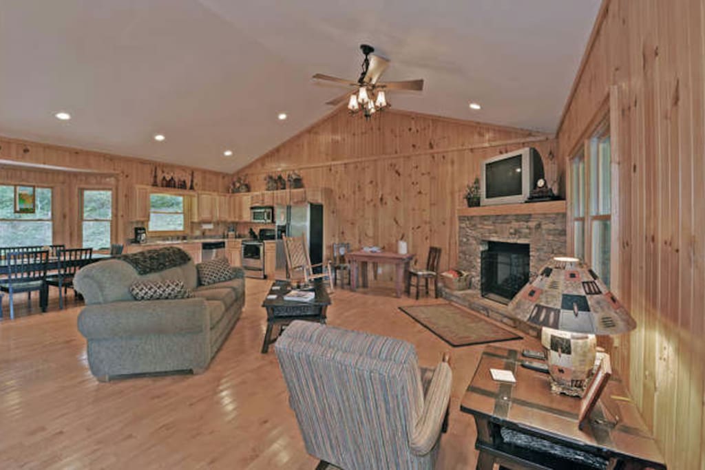 Large open concept living room with beautiful fireplace.