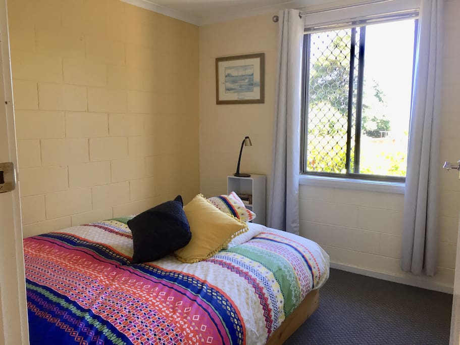The main bedroom has plenty of space and a queen bed