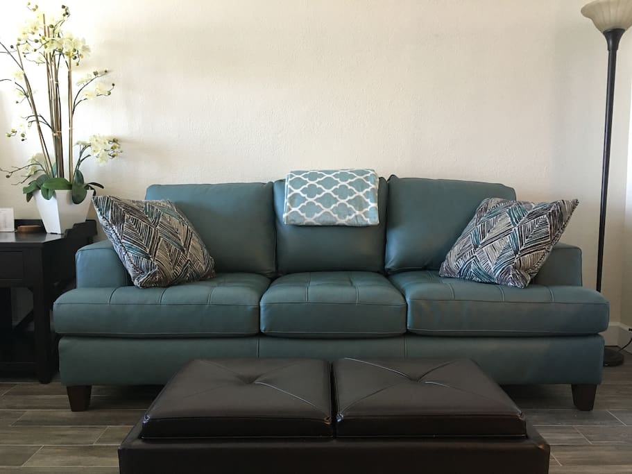 Plush leather queen size couch for your seating comfort. It also opens up as a sleeper with a upgraded memory foam mattress.