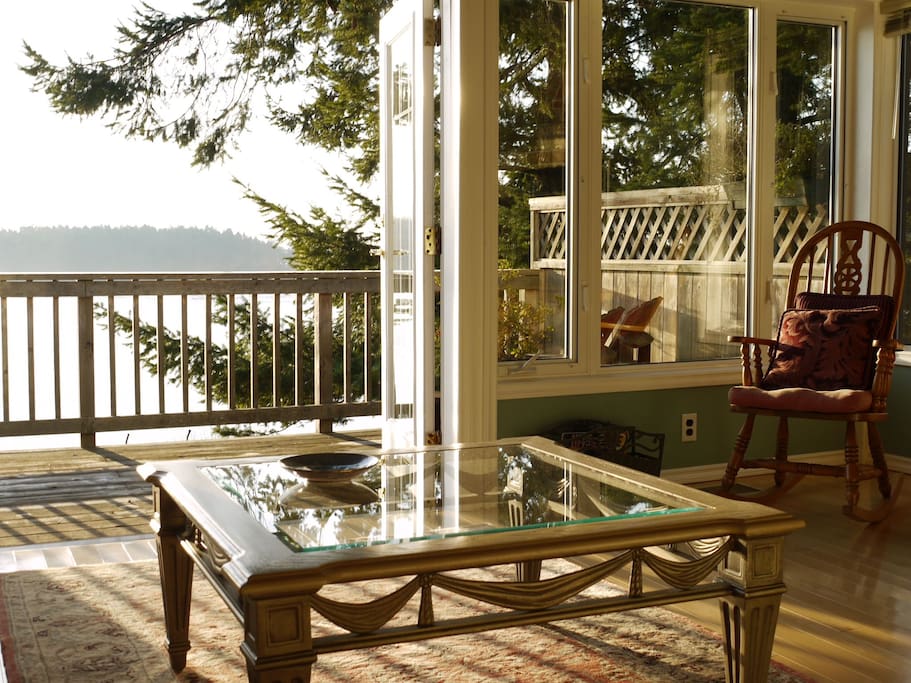 The modern living room with its southern exposure, is bathed in sunshine all day.