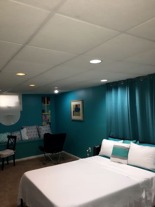 This bed replaced the white rod iron bed in the others pics. There is now a Queen bed and an additional air mattress. This room is huge.