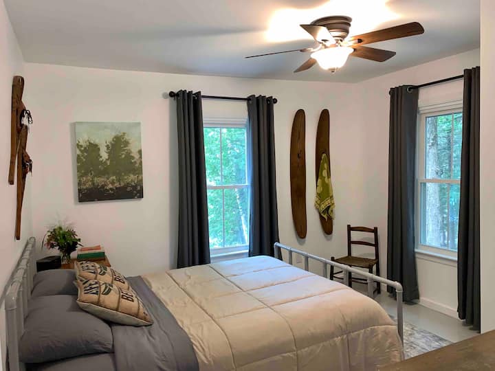 Downstairs bedroom with a queen bed.