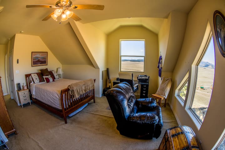 Upper level bedroom and desk. You won't believe the great views from here.  Also a hammock for relaxing. 