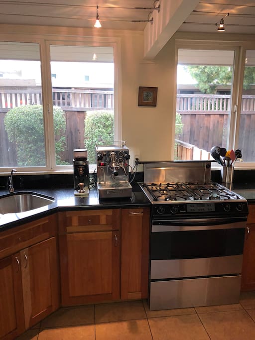 Four burner gas stove and an espresso bar