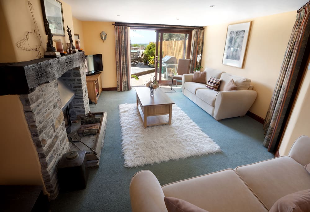 Private lounge with cosy wood-burner for any cooler evenings
