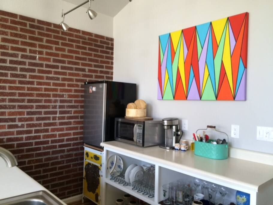 Kitchenette with exposed brick