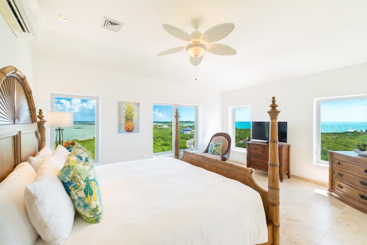 Master suite with TV, patio access and King bed