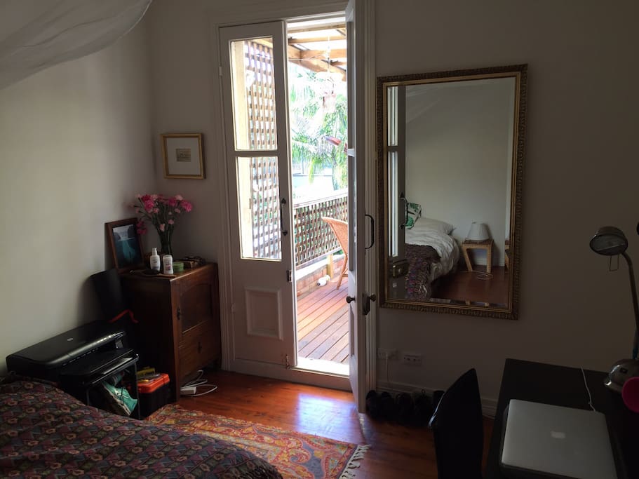 Doors leading to large outdoor balcony