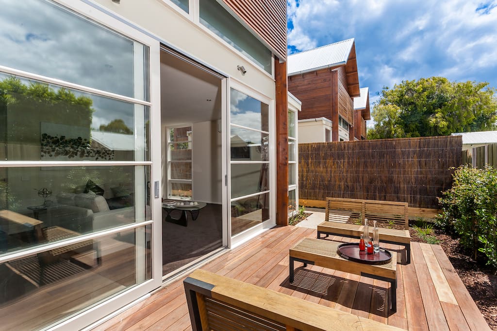 The sun-drenched deck is a relaxing, serene space.