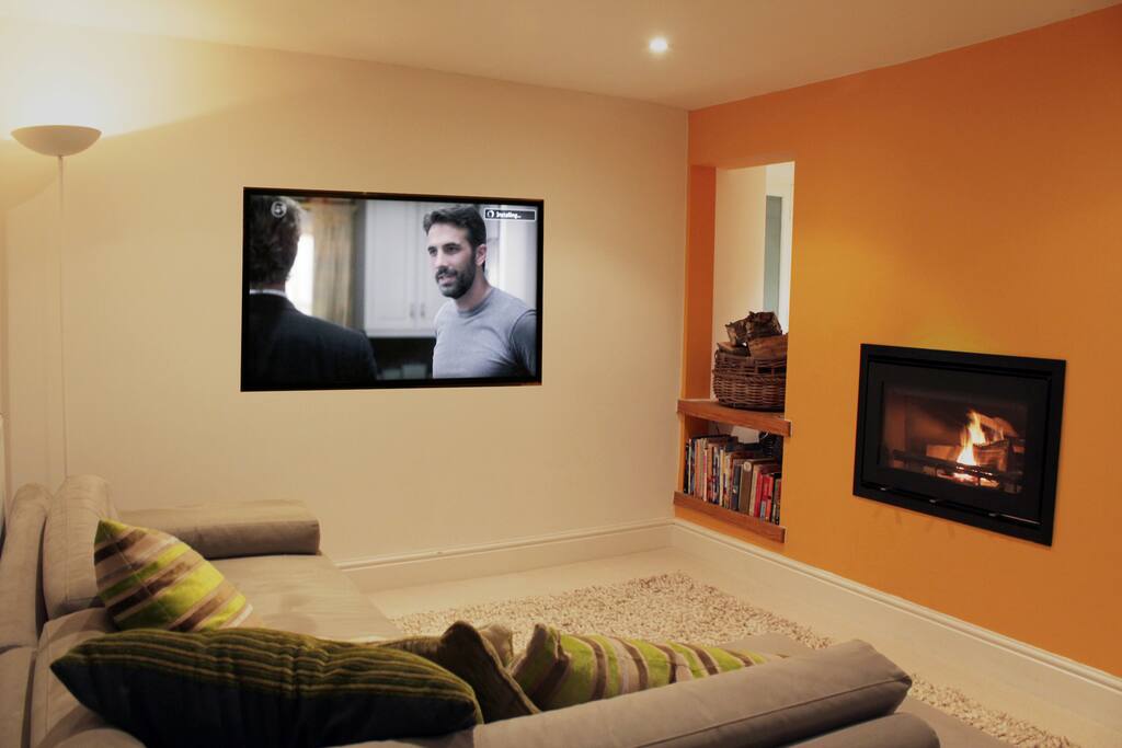 Living room with built in wall woodburner