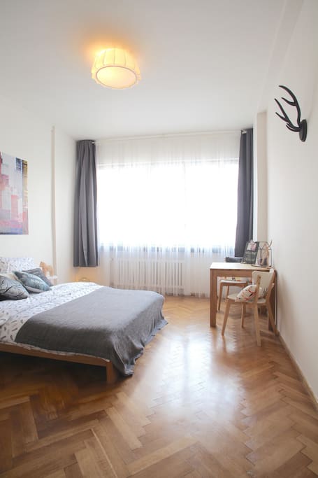 Authentic wooden floors and modern decoration are creating a nice atmosphere in the apartment.