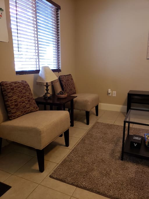 guest chairs with side table and lamp