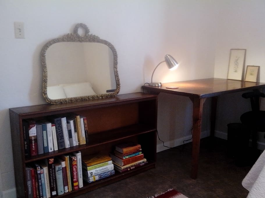 desk and bookshelf on the south wall