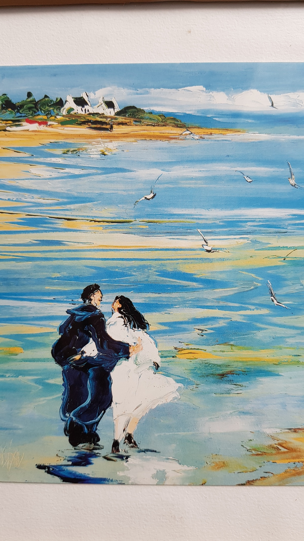 A vibrant painting depicts a couple walking hand in hand along a serene beach. The background features gentle waves and a coastal landscape, while seagulls are seen flying above, enhancing the peaceful ambiance of the scene.