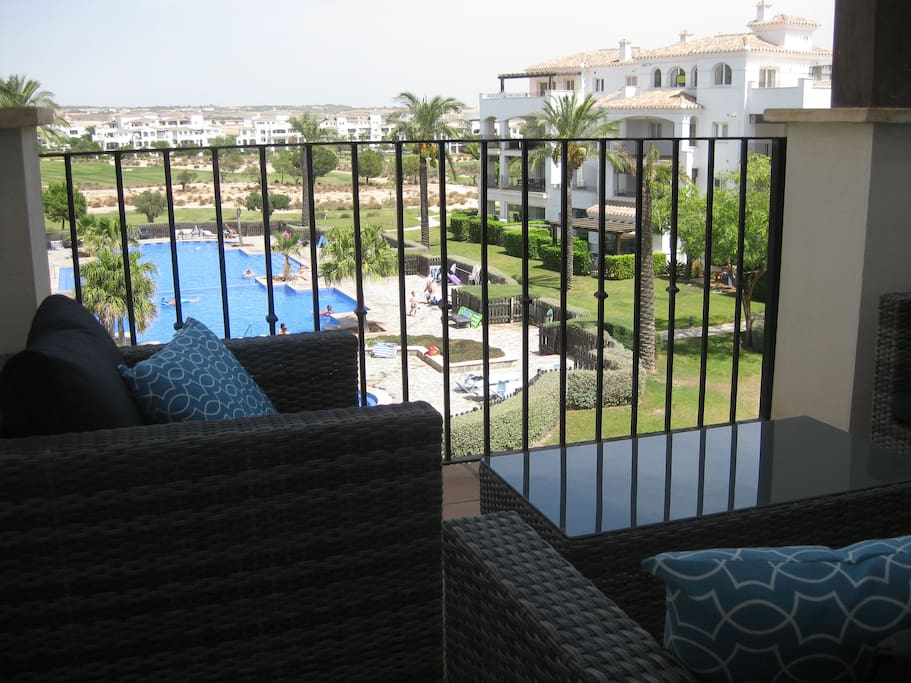 Outdoor furniture overlooking the pool