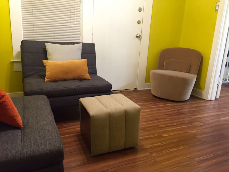 The living room is small, cozy, and quite functional.