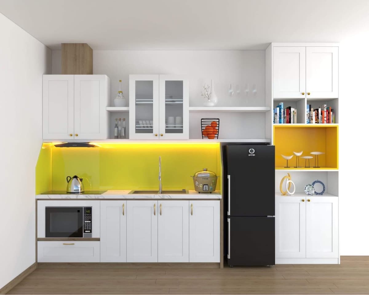 The kitchen features a modern white cabinetry design, accented by a bright yellow backsplash. Essential appliances, including a microwave and refrigerator, are present. Open shelves display glassware and decorative items, providing ample storage space and a clean, organized appearance.