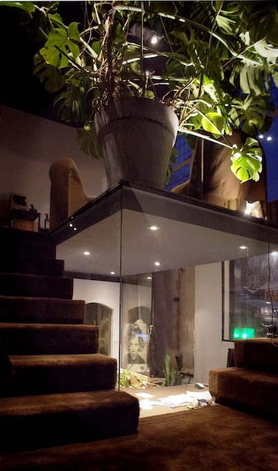 This is where you enter; there are stairs that go up (window seat, kitchen..) and ones that go down (bedroom, bathroom..)