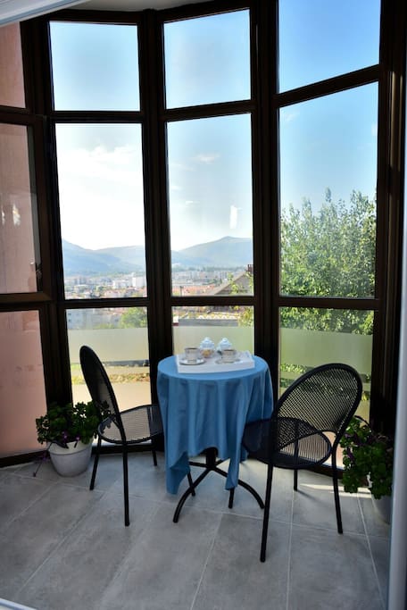 Sunny balcony where you can enjoy morning coffe.